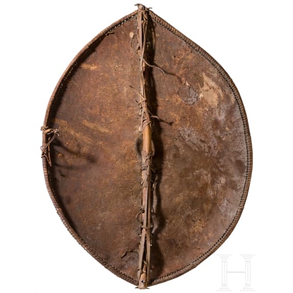 A large Massai shield and African weapons, circa 1900