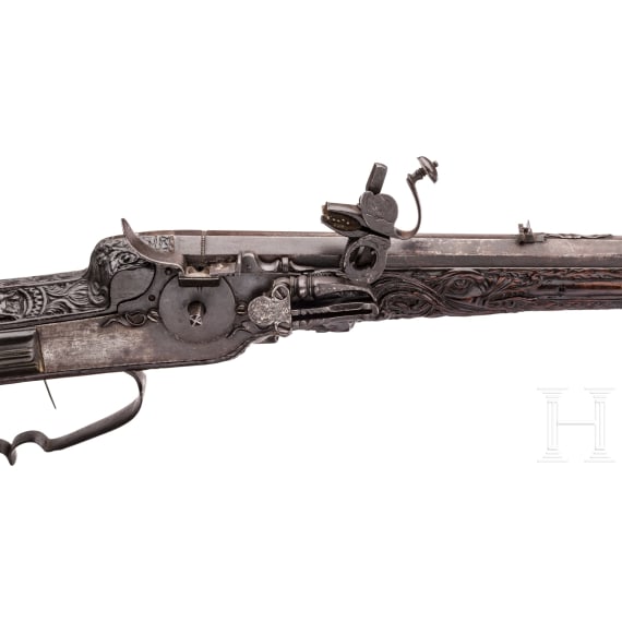 A southern German carved wheellock rifle with mother-of-pearl inlays in the style of the Maucher family of Schw&auml;bisch-Gm&uuml;nd, late 17th century
