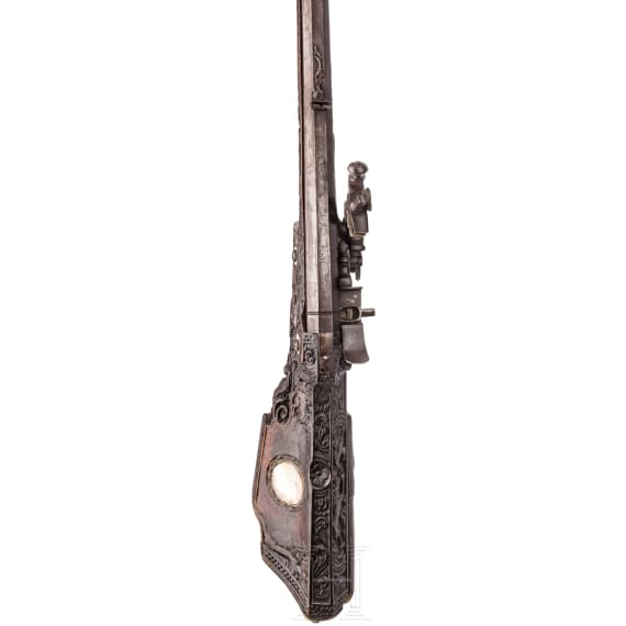 A southern German carved wheellock rifle with mother-of-pearl inlays in the style of the Maucher family of Schw&auml;bisch-Gm&uuml;nd, late 17th century