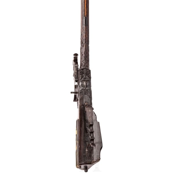 A southern German carved wheellock rifle with mother-of-pearl inlays in the style of the Maucher family of Schw&auml;bisch-Gm&uuml;nd, late 17th century