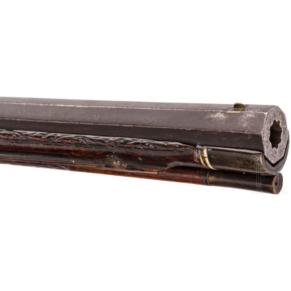 A southern German carved wheellock rifle with mother-of-pearl inlays in the style of the Maucher family of Schw&auml;bisch-Gm&uuml;nd, late 17th century