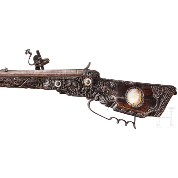 A southern German carved wheellock rifle with mother-of-pearl inlays in the style of the Maucher family of Schw&auml;bisch-Gm&uuml;nd, late 17th century