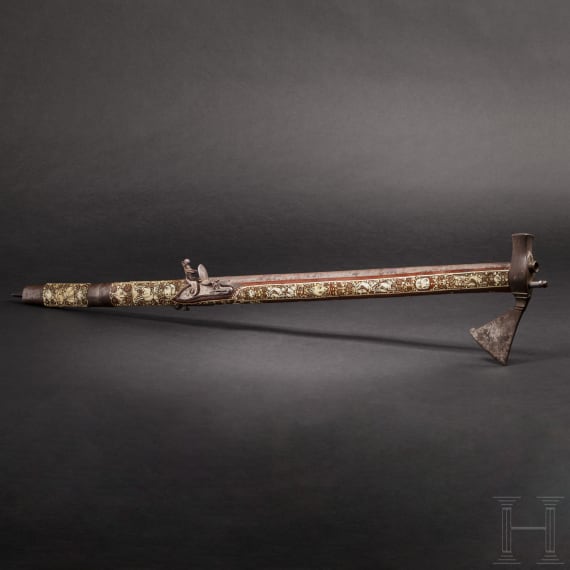 A Silesian battle axe with integrated flintlock and dagger, circa 1700