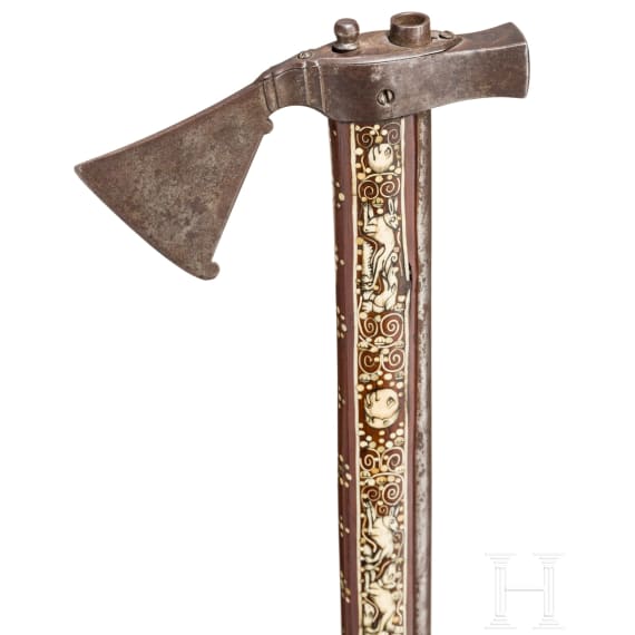 A Silesian battle axe with integrated flintlock and dagger, circa 1700
