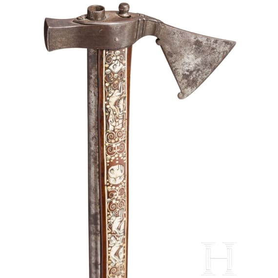 A Silesian battle axe with integrated flintlock and dagger, circa 1700