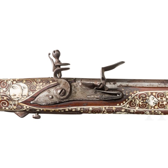 A Silesian battle axe with integrated flintlock and dagger, circa 1700