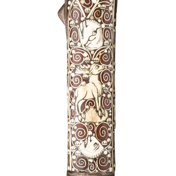 A Silesian battle axe with integrated flintlock and dagger, circa 1700