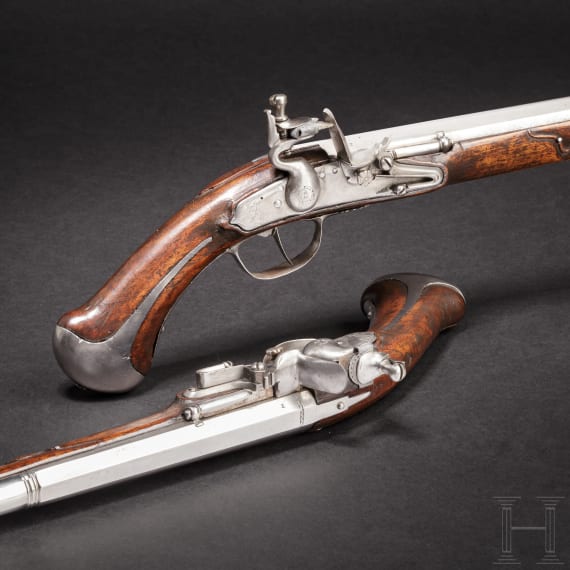 A rare pair of flintlock holster pistols made for superimposed loads, from the armoury of the Princes of Salm-Reifferscheidt-Dyck, northern German or Dutch, circa 1660