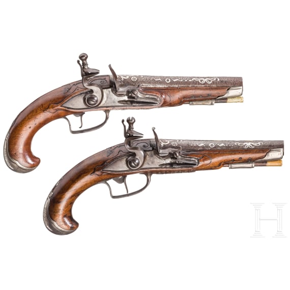 A pir of silver-mounted flintlock travel pistols, German/France, ca. 1730