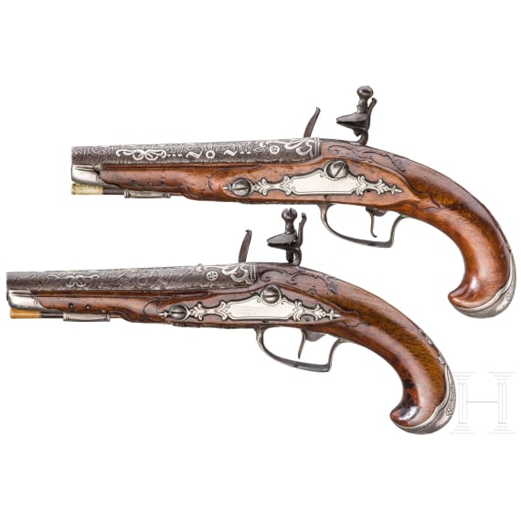 A pir of silver-mounted flintlock travel pistols, German/France, ca. 1730