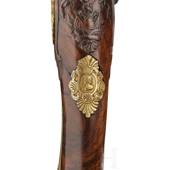 A deluxe German flintlock pistol with fine chiselling, circa 1730