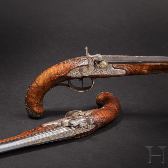 A fine pair of southern German percussion pistols with chiseled mounts, circa 1780