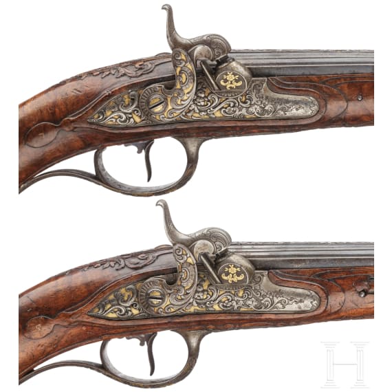 A fine pair of southern German percussion pistols with chiseled mounts, circa 1780