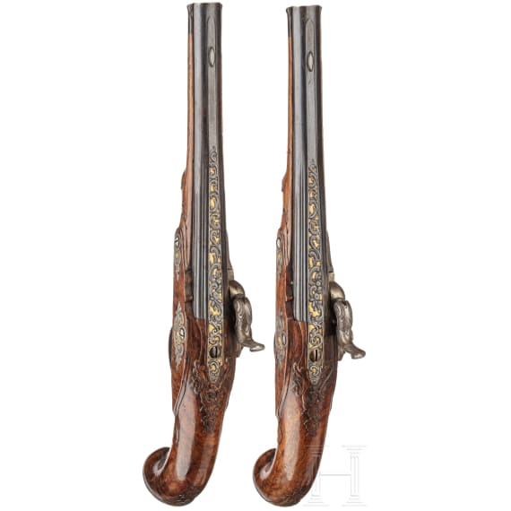 A fine pair of southern German percussion pistols with chiseled mounts, circa 1780