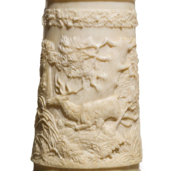 A German silver-mounted powder flask of ivory, mid-19th century