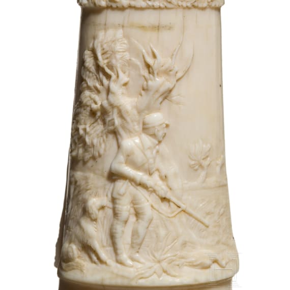 A German silver-mounted powder flask of ivory, mid-19th century