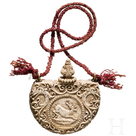 A German carved powder flask made of ivory, 19th century