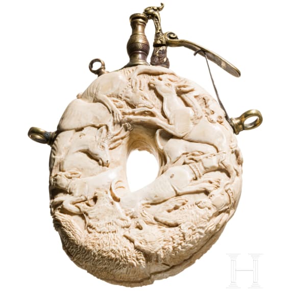 A carved German hunting powder flask (ivory) in the style of the Maucher workshop, 19th century