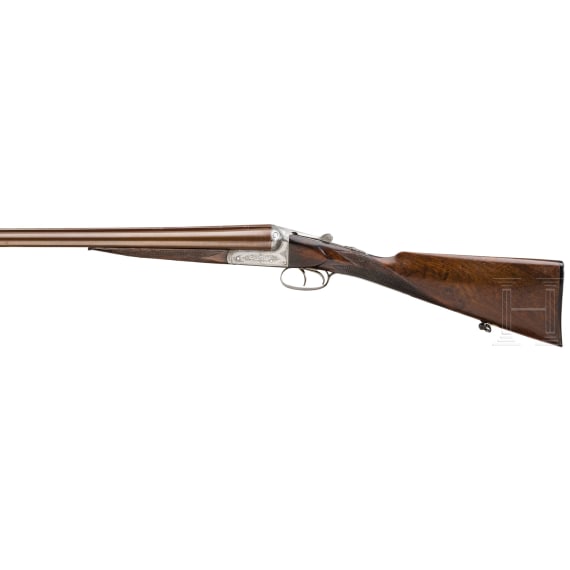 A cased side-by-side shotgun by Woodward & Son