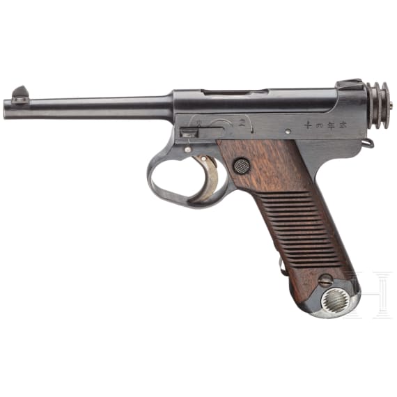 A Nambu Type 14 with large trigger guard and holster