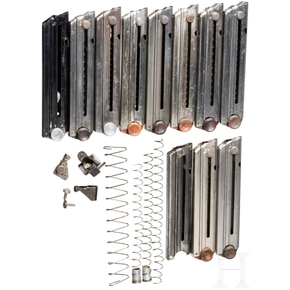 A mixed lot Luger magazines and mag parts