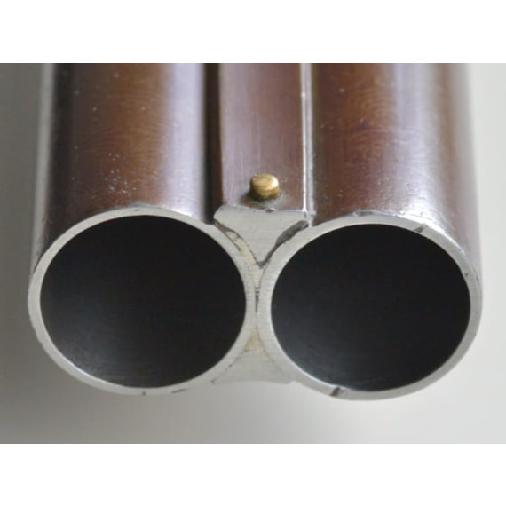 A cased side-by-side shotgun by Woodward & Son