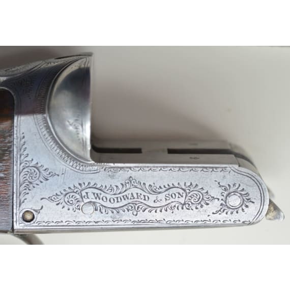 A cased side-by-side shotgun by Woodward & Son