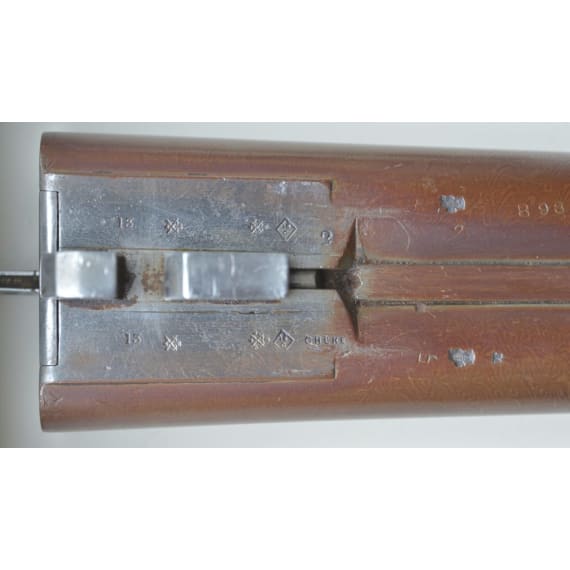 A cased side-by-side shotgun by Woodward & Son