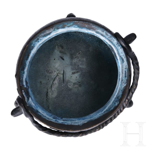 A small German bronze cauldron, dated 1557