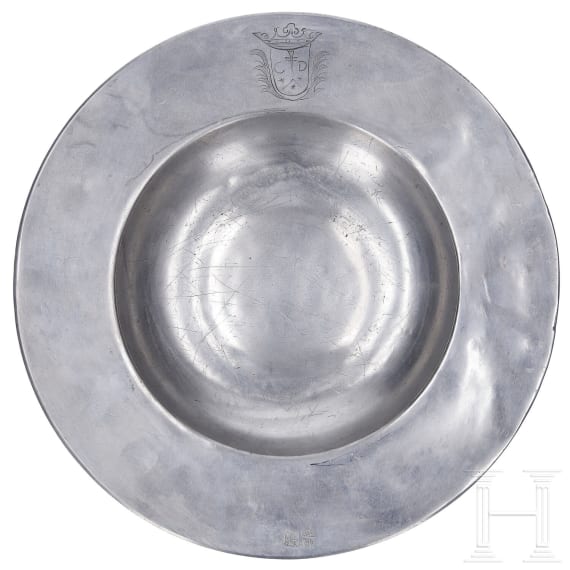 An Austrian broadrim charger and two pewter jugs, Salzurg, 17th and early 18th century