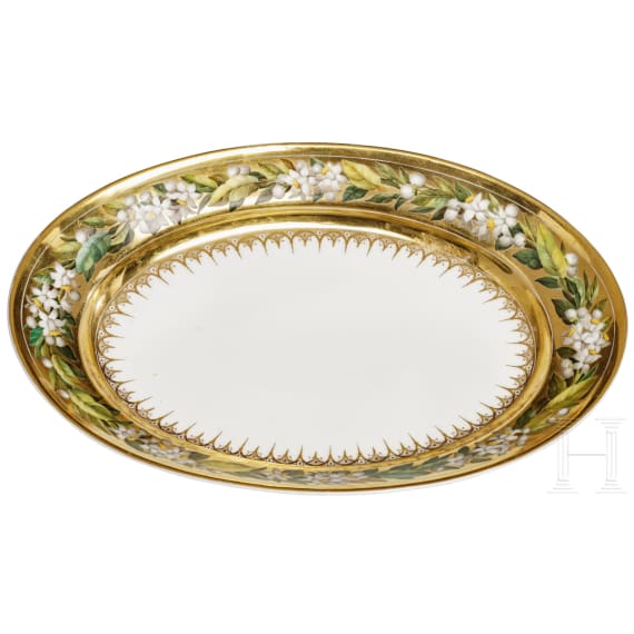 A porcelain bowl with a broad gold rim and flowers, 20th century