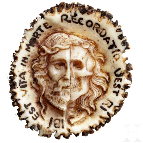 A carved German deer amulet with Memento Mori head, 19th century