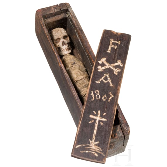 A southern German/Alpine memento mori skeleton in a coffin, dated 1807