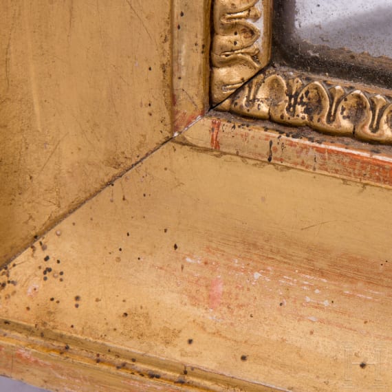 A large carved and originally gilded German neoclassical mirror, circa 1800
