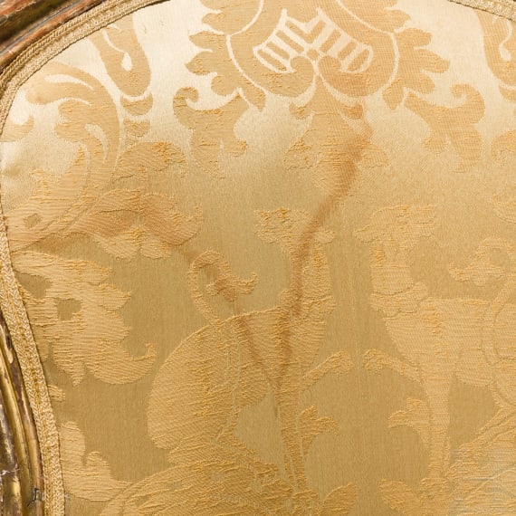 A carved and gilded French Louis XV fauteuil, 18th century