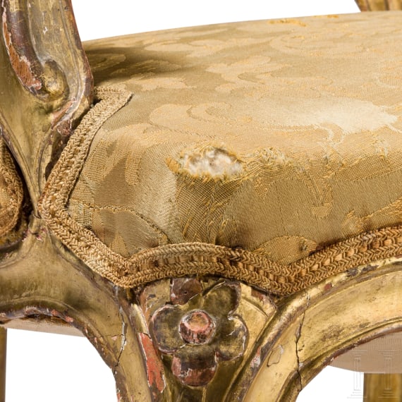 A carved and gilded French Louis XV fauteuil, 18th century