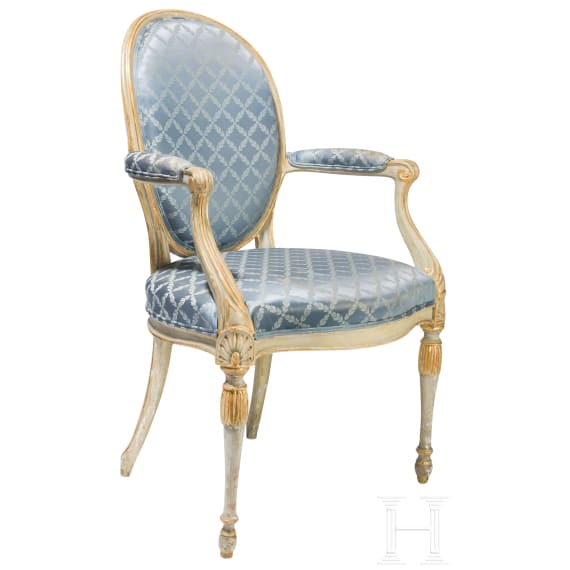 A carved Swedish/Scandinavian neoclassical fauteuil, painted white and partly gilded, early 19th century