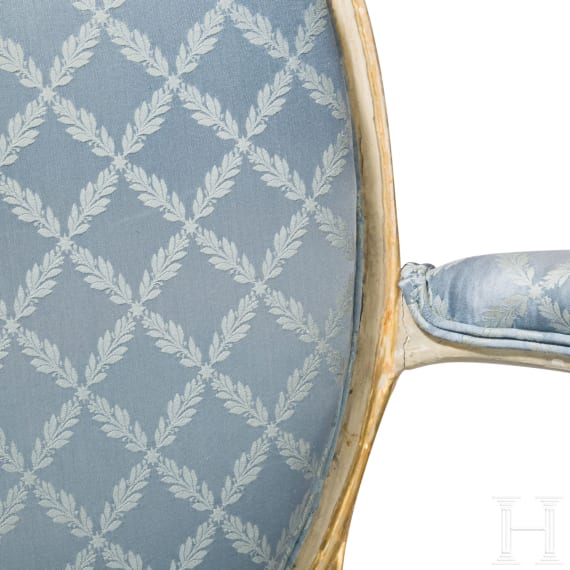 A carved Swedish/Scandinavian neoclassical fauteuil, painted white and partly gilded, early 19th century