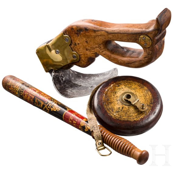 A carpenter's adze, a baton and a tape measure