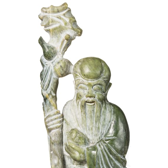 A figure of the god Shoulao in light green nephrite, 20th century