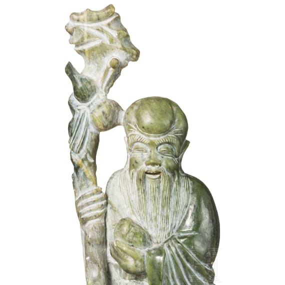 A figure of the god Shoulao in light green nephrite, 20th century