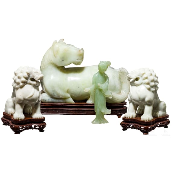 A pair of Chinese lions, a nephrite horse and a nephrite statuette, 20th century