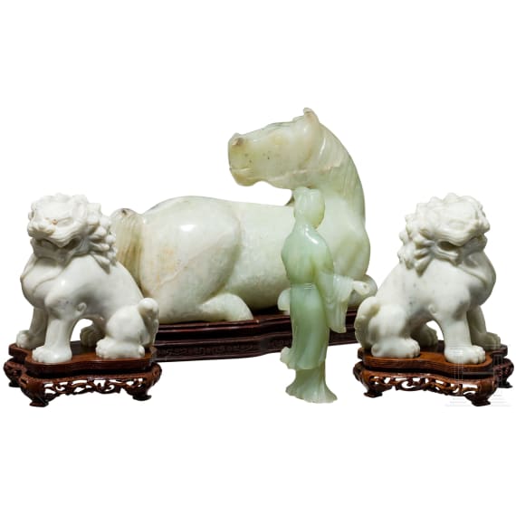 A pair of Chinese lions, a nephrite horse and a nephrite statuette, 20th century