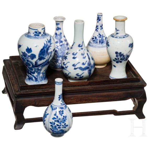 A set of six Chinese miniature vases on a stand, 18th/19th century