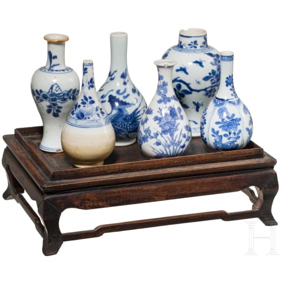 A set of six Chinese miniature vases on a stand, 18th/19th century
