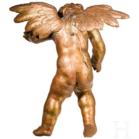 A carved and gold painted putto, German, 18th century