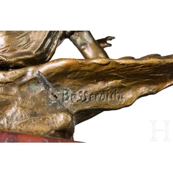 Ruffino Besserdich (1852 - ?) - a small bronze sculpture of a child with eagle