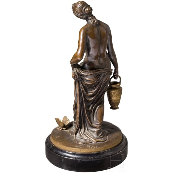 A bronze figure of a nymph fetching water, signed "J.G. Rau"