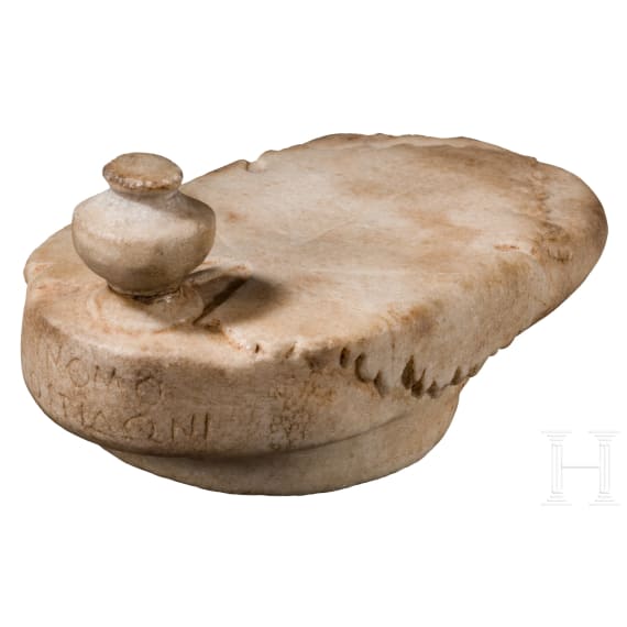 A Greek marble lid with a vine leaf and inscription, 5th - 4th century B.C.