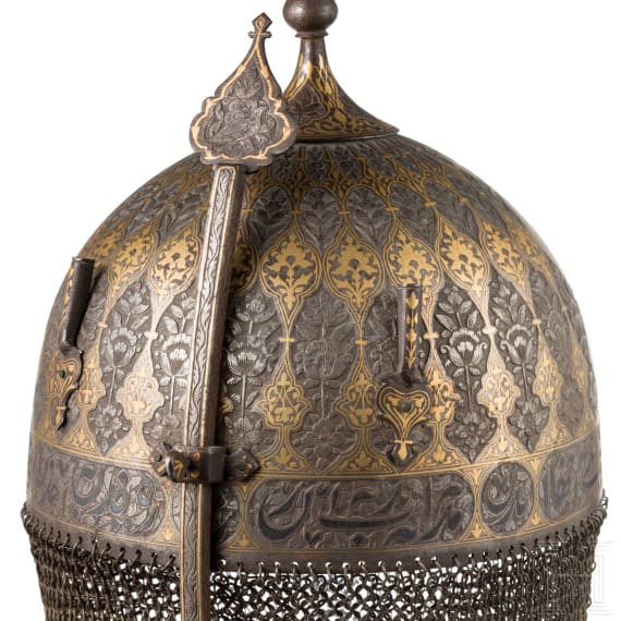 A chiselled and gold-damascened Persian helmet and shield, 19th century